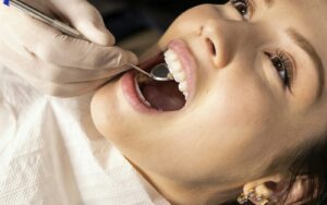 Dentist examining a patient during an emergency dental visit
