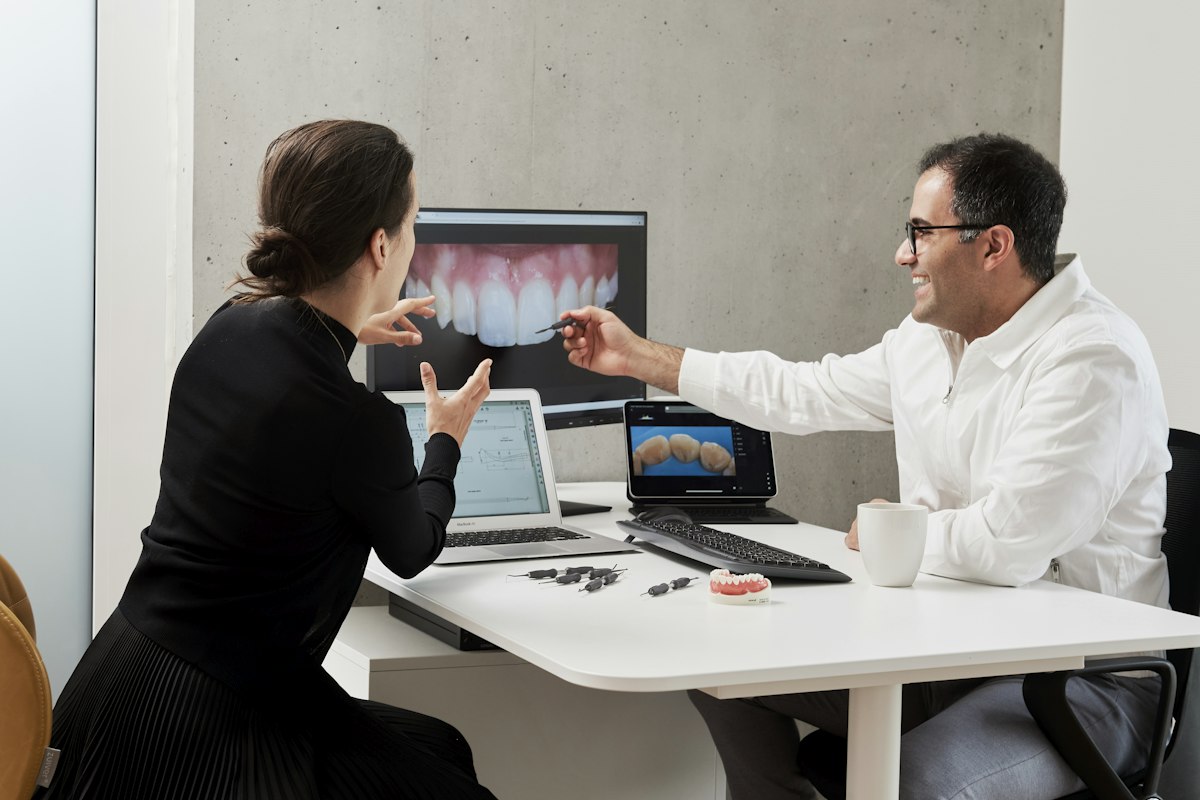Dentist reviewing a treatment plan covered by Medicaid in Columbus, Indiana